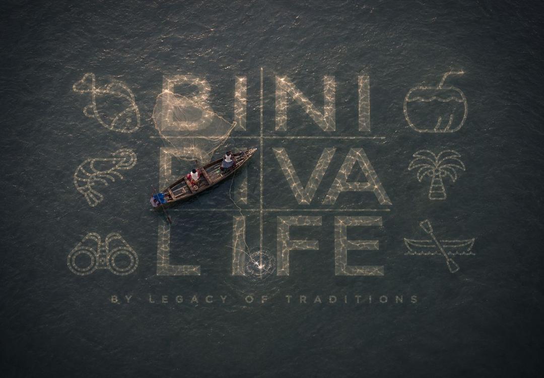 Aerial view of a wooden canoe on dark river water with the words BINI RIVA LIFE drawn in glowing string-light wordmark and hand-drawn river glyphs surrounding it